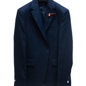 Navy blazer with lapel pin – premium finishing touch.